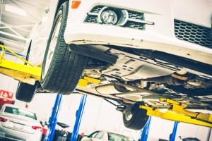Vehicle up on a lift for maintenance and fluid service